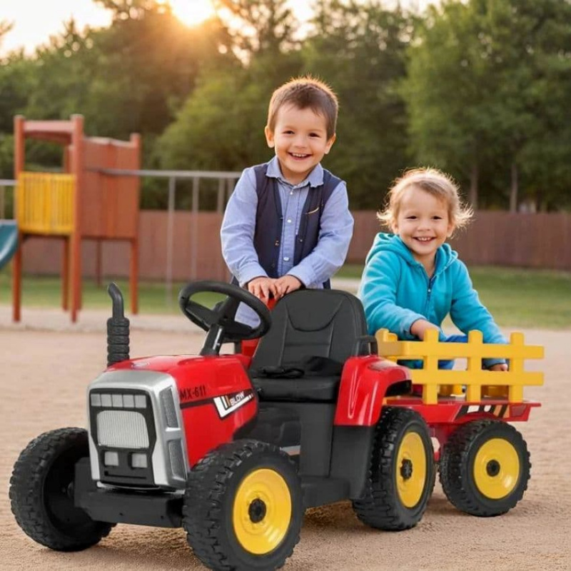 Діти катаються на дитячому електротракторі